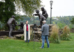 Independent film maker interviewing Susan Geissler at Freedom Crossing Monument